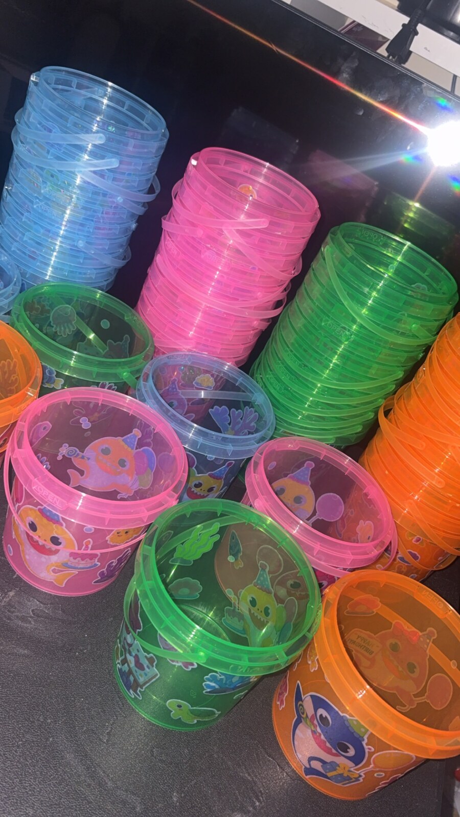 Colorful translucent Baby Shark party favor buckets